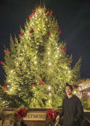 Joshua Wu with Christmas tree
