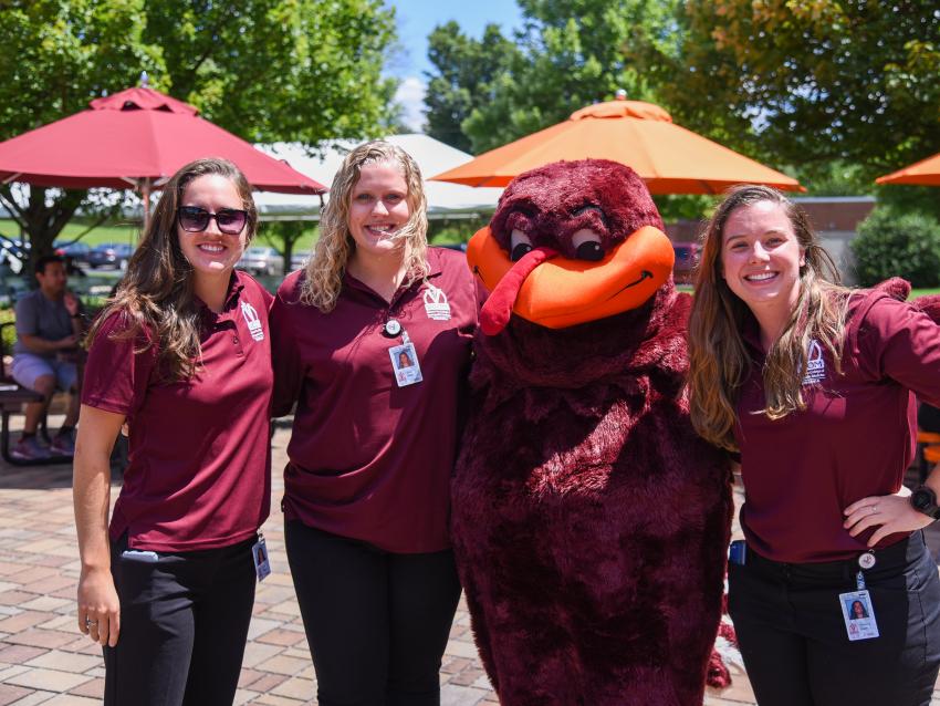 Students pose with the the Virginia Tech Hokie Bird mascot.