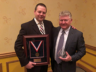 Mark Rogers, DO, and Gunnar Brolinson, DO, receiving awards at the AOASM Clinical Conferece