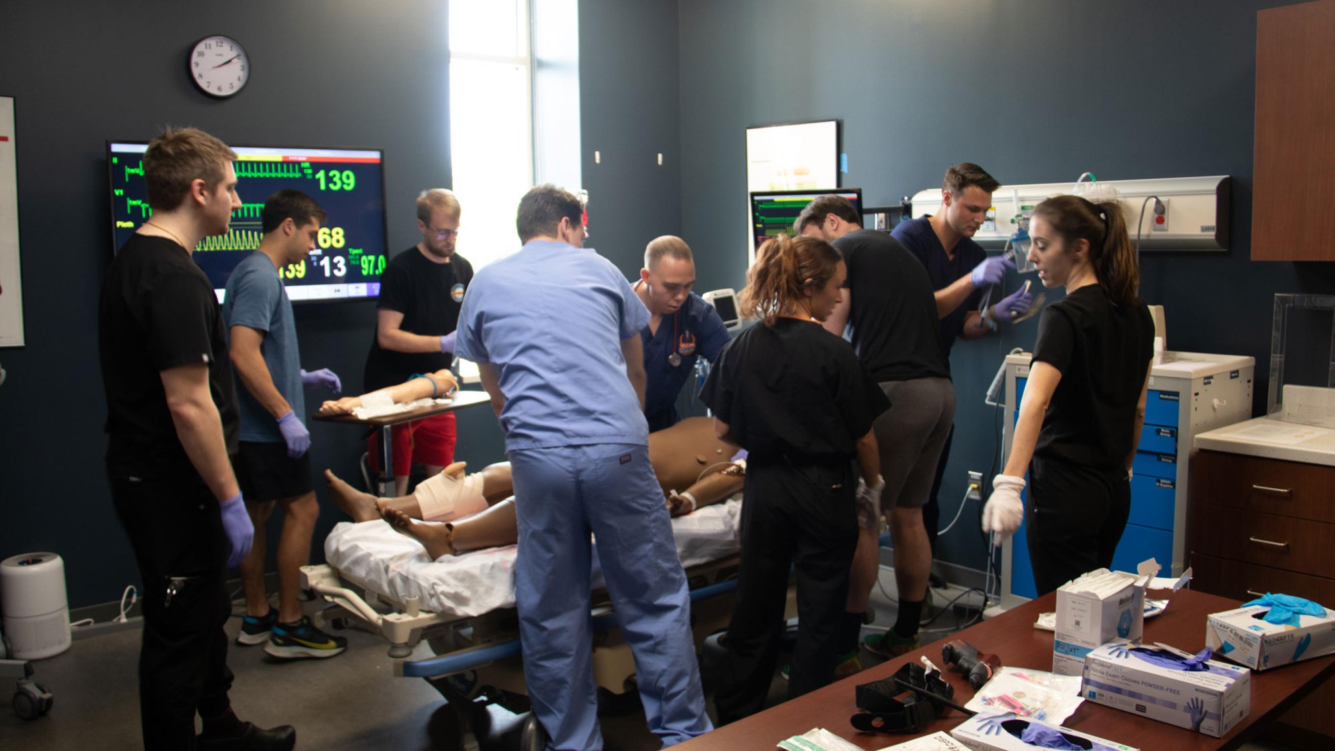 VCOM-Carolinas students in a simulation room working