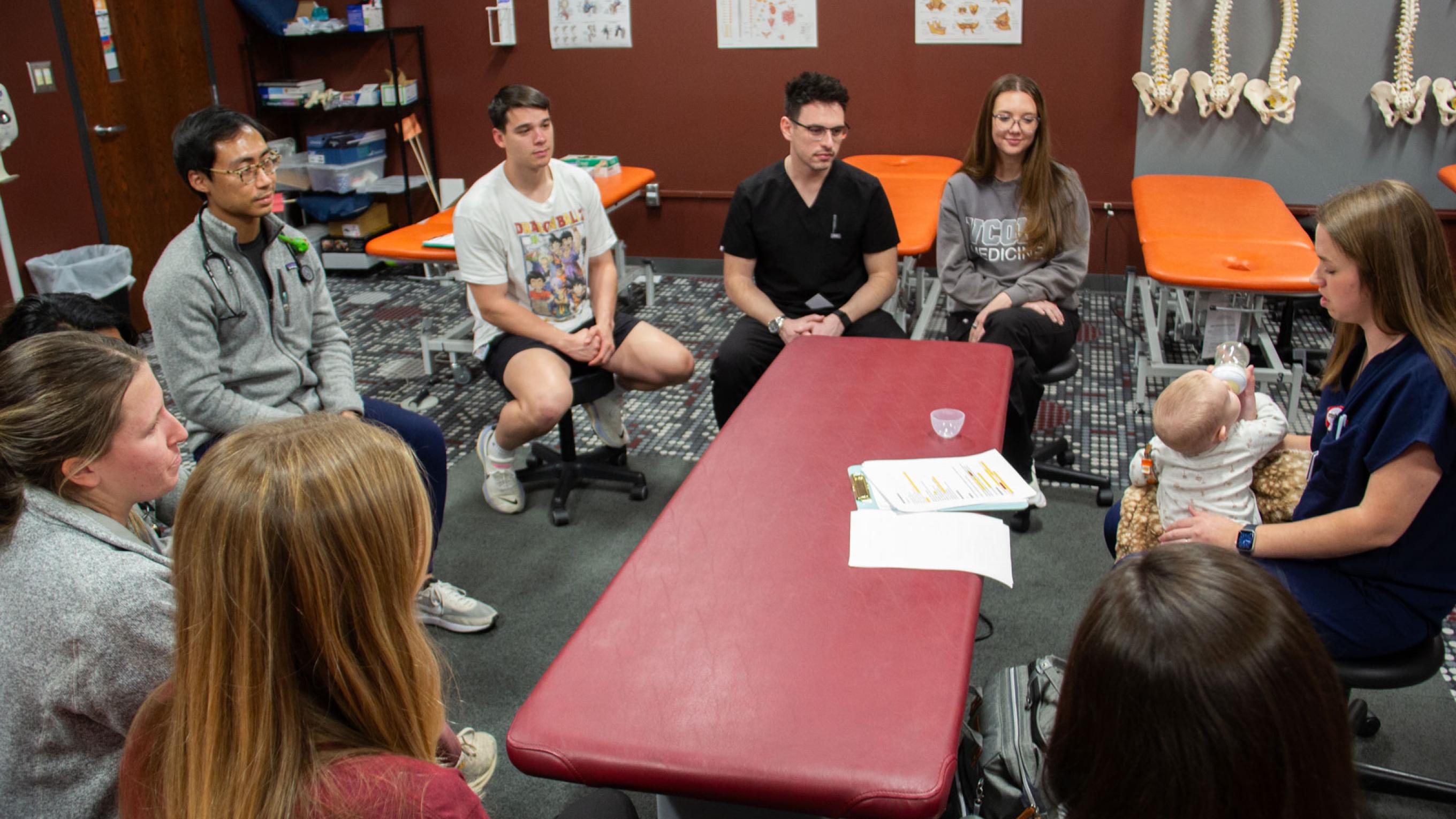 VCOM-Carolinas students sitting in a circle discussion