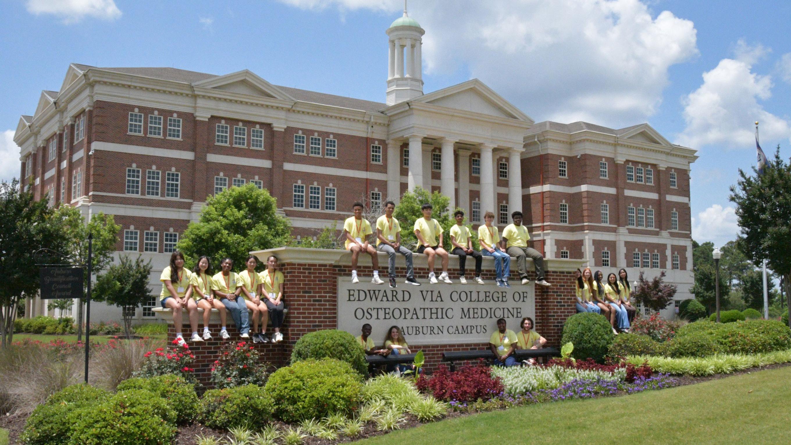 Summer Enrichment Experience attendees in front of VCOM-Auburn building.