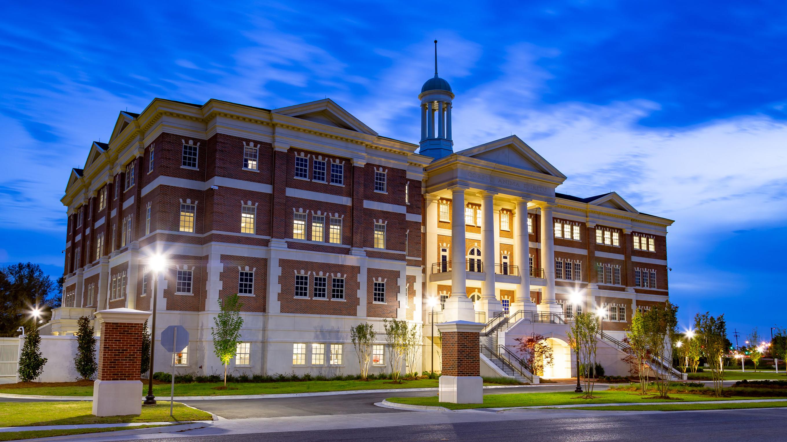 VCOM-Louisiana campus building at dusk