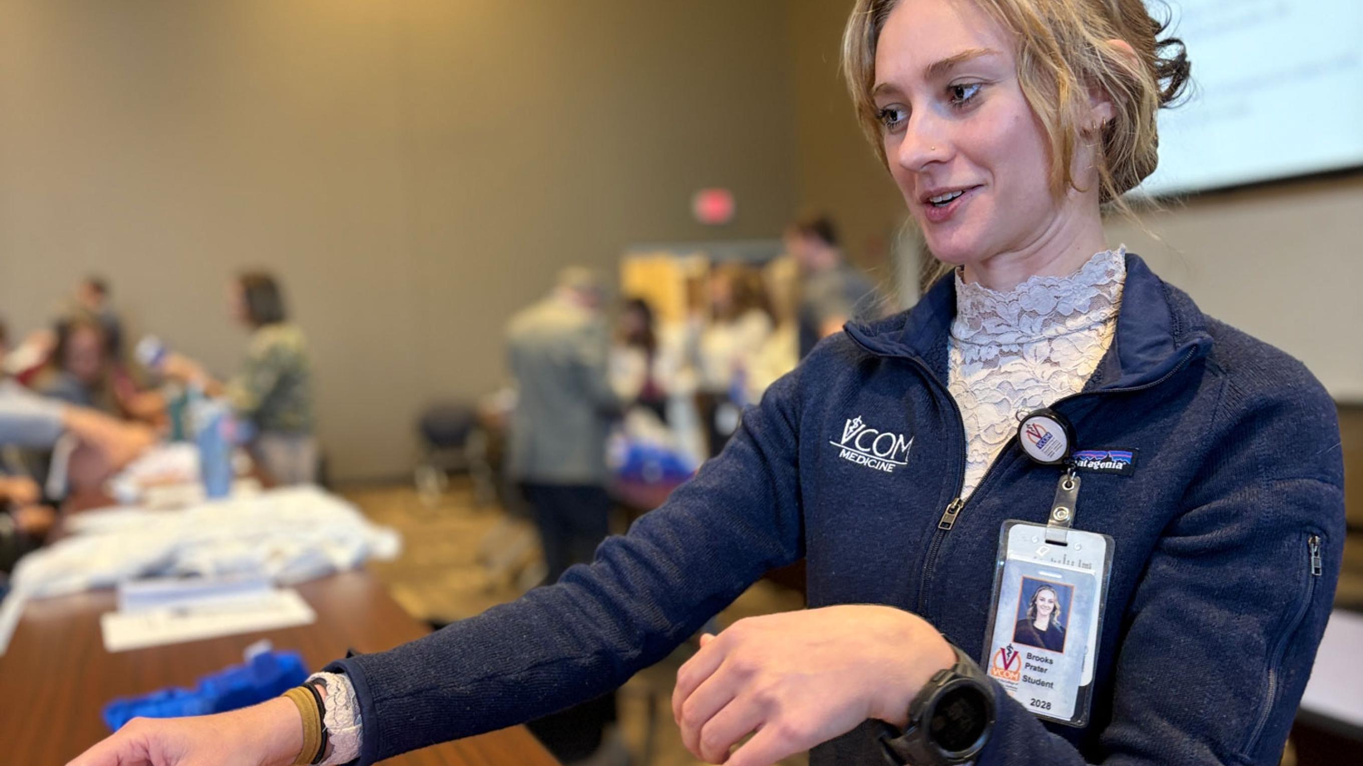 Person working and learning during the stop the bleed training session