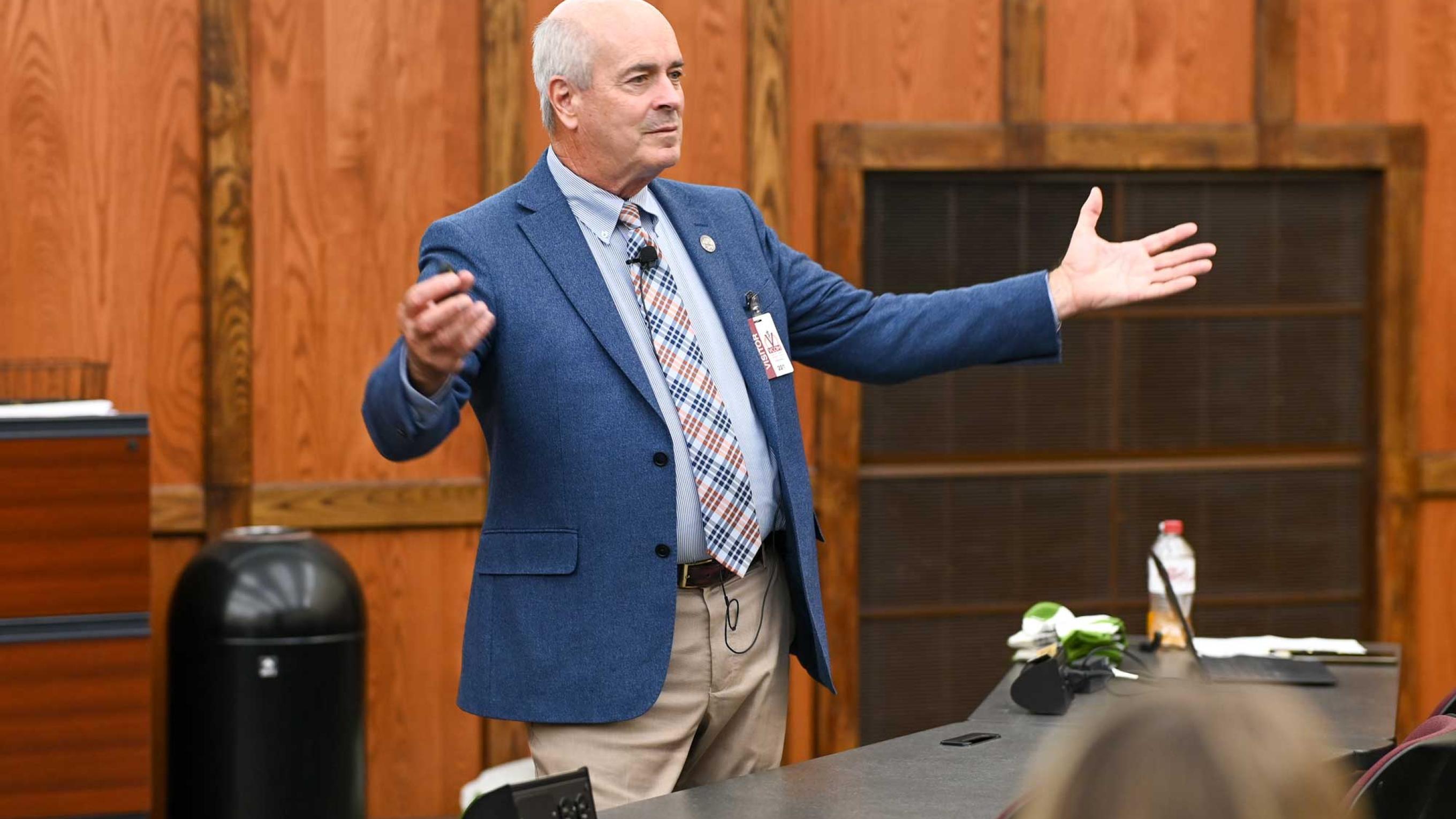 John R. Gimpel, DO, MEd speaking in front of students