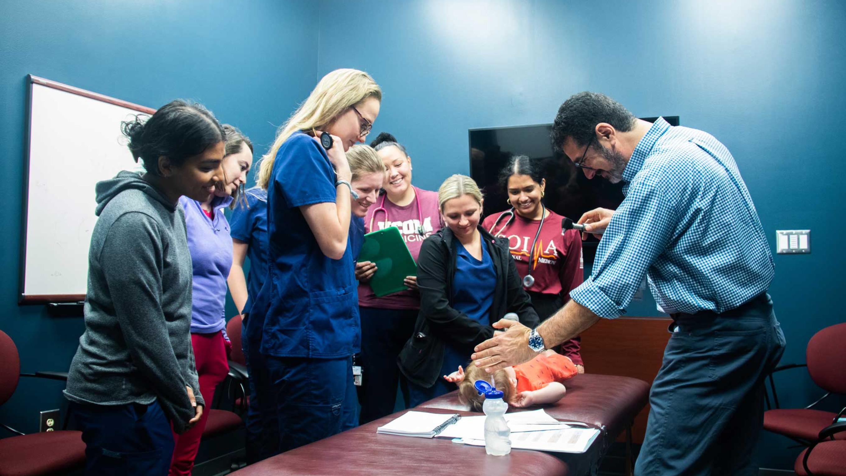 Dr. Sahhar with students during a pediatric bootcamp
