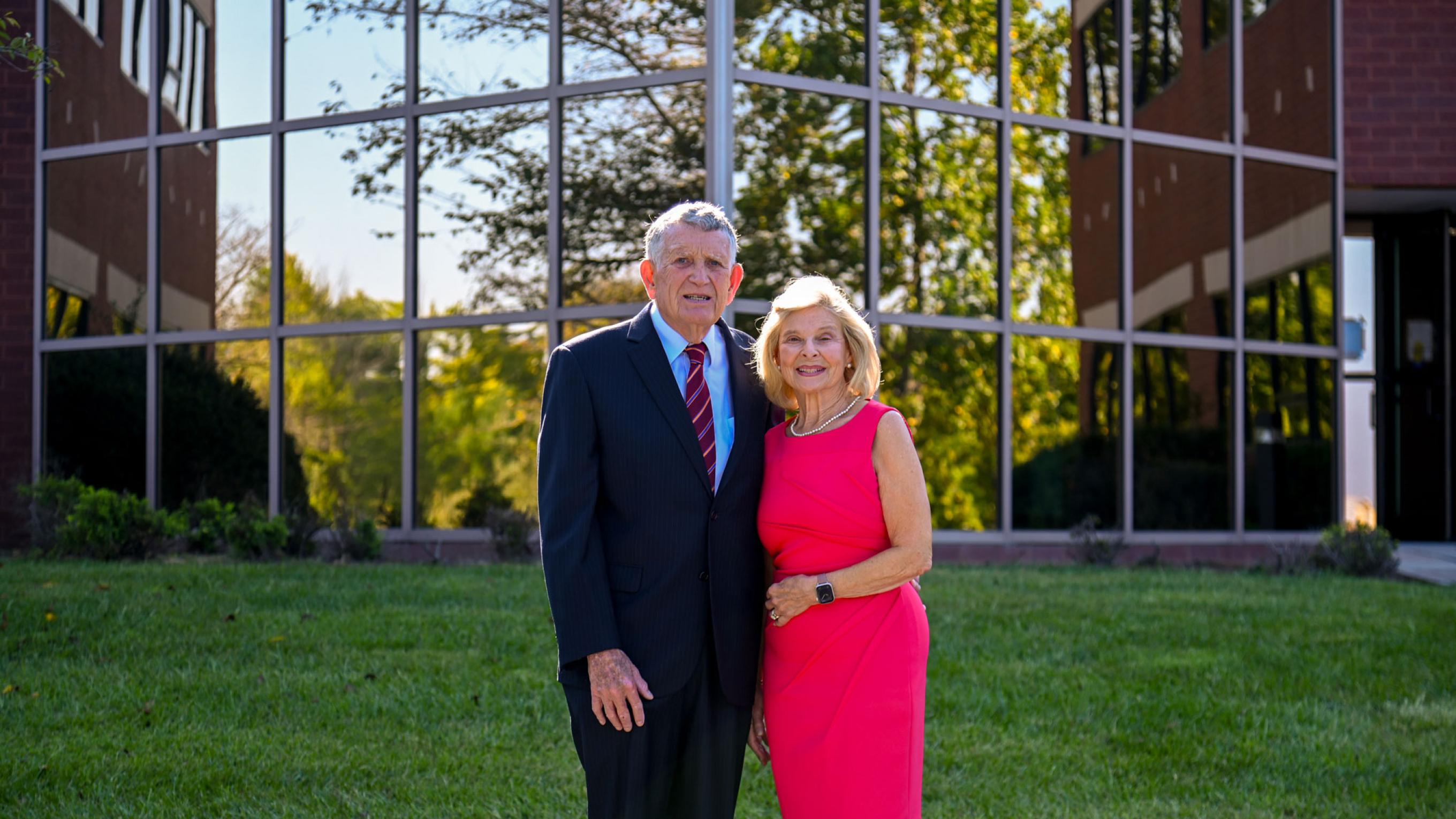 H. Pat and Nancy E. Artis standing in front of the New Health Sciences Education Building