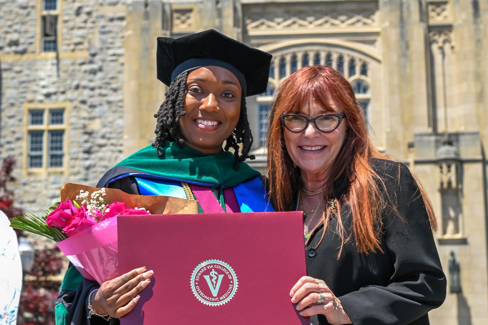 graduate posing with dean willcox