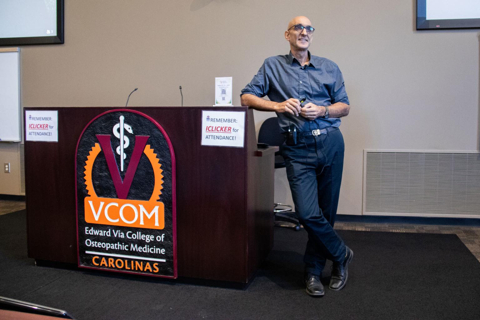 Tom Catena, MD speaking at a podium