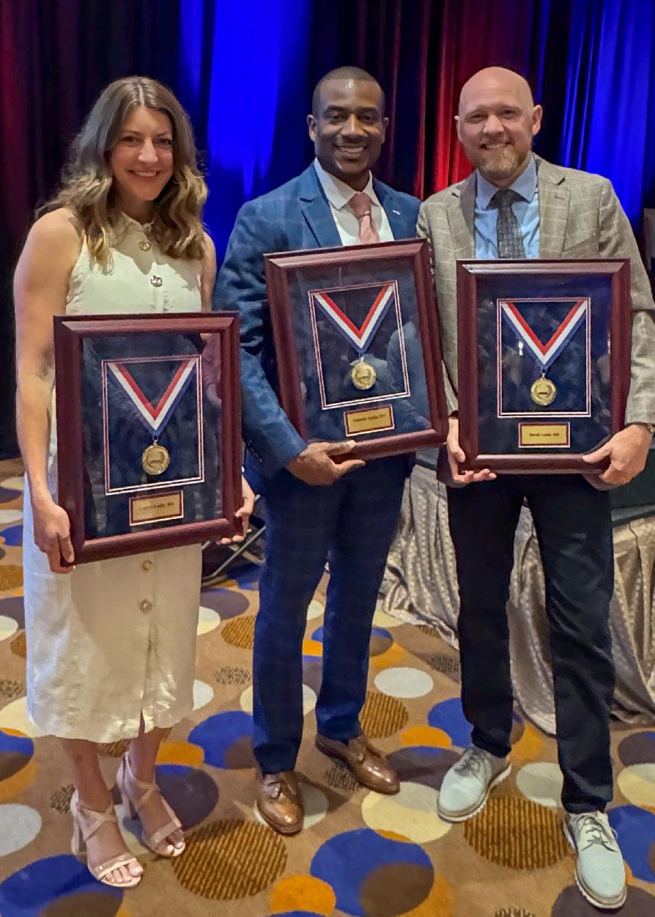 VCOM-Virginia fellowship alumni Bode Agaja, DO; Dave Leslie, DO accept FAOASM Award of Fellow distinction.
