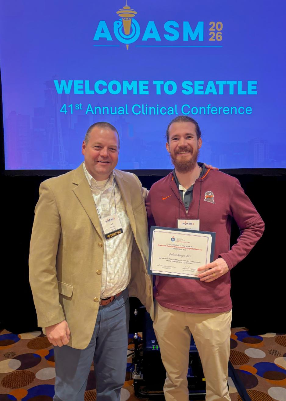 Newly appointed AOASM president Dr. Mark Rogers with 1st place research poster recipient Dr. Andrew Krueger.