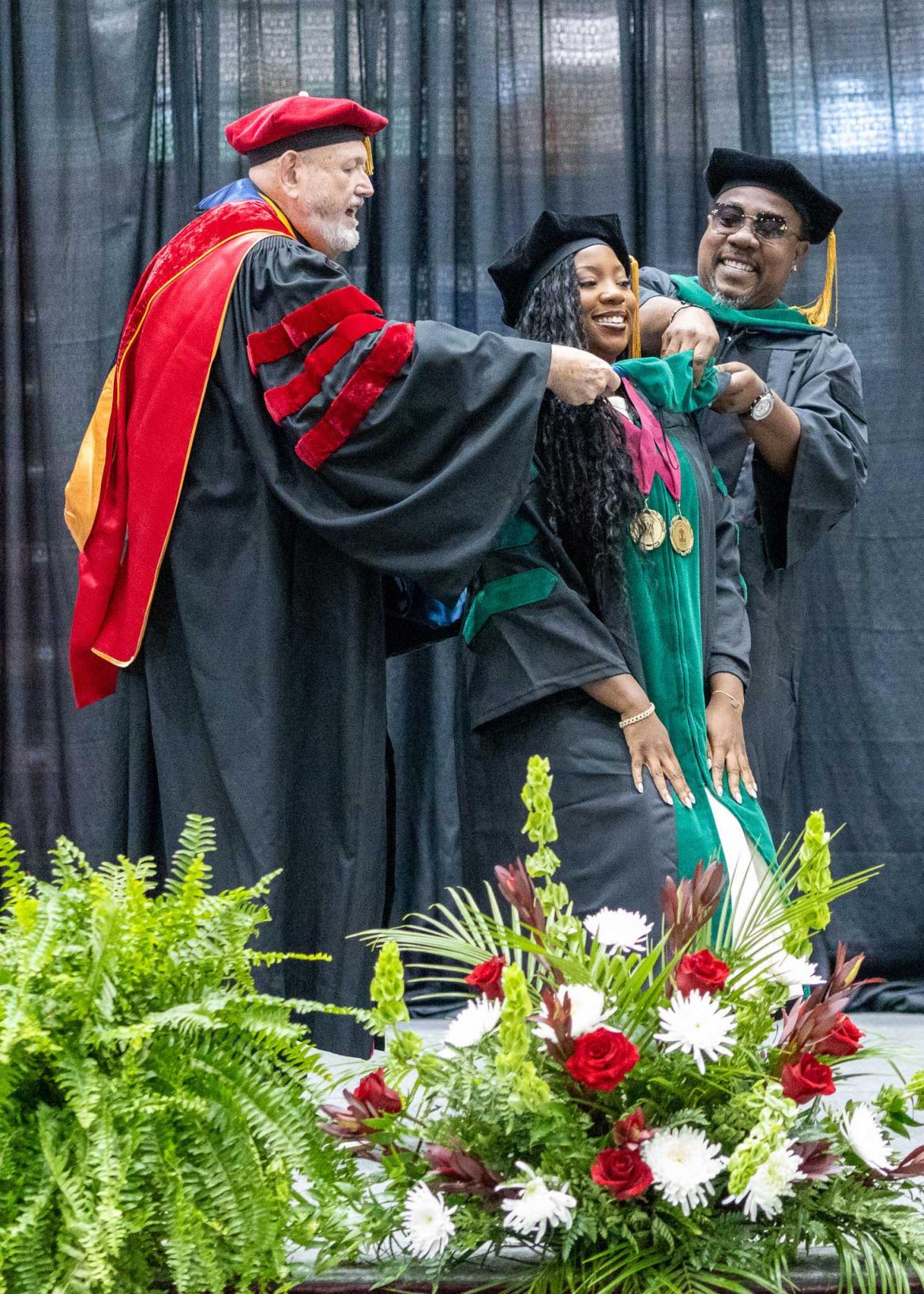 VCOM Louisiana class of 2026 graduate being hooded on stage