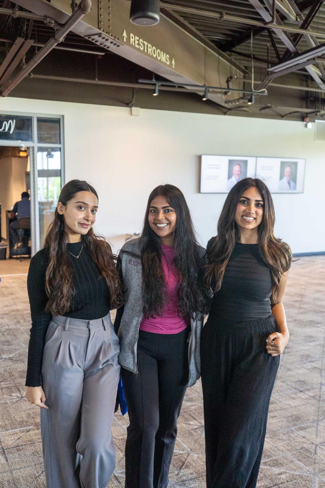 Three VCOM-Carolinas students smiling