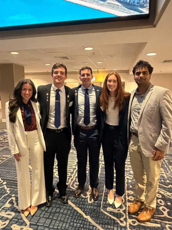 VCOM-Auburn representatives smiling