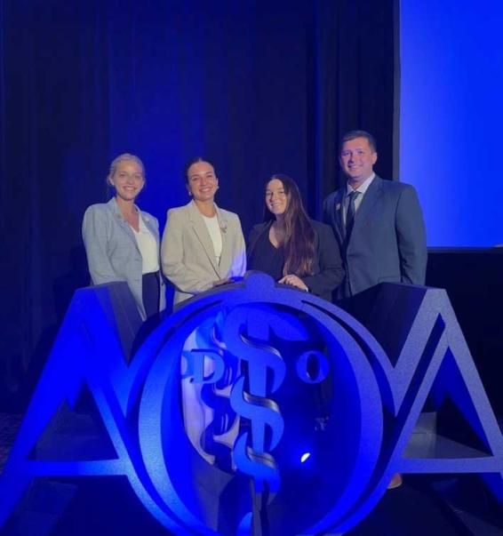 VCOM-Carolinas representatives smiling on stage