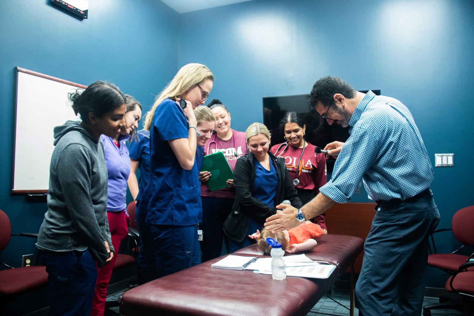 Dr. Sahhar with students during a pediatric bootcamp