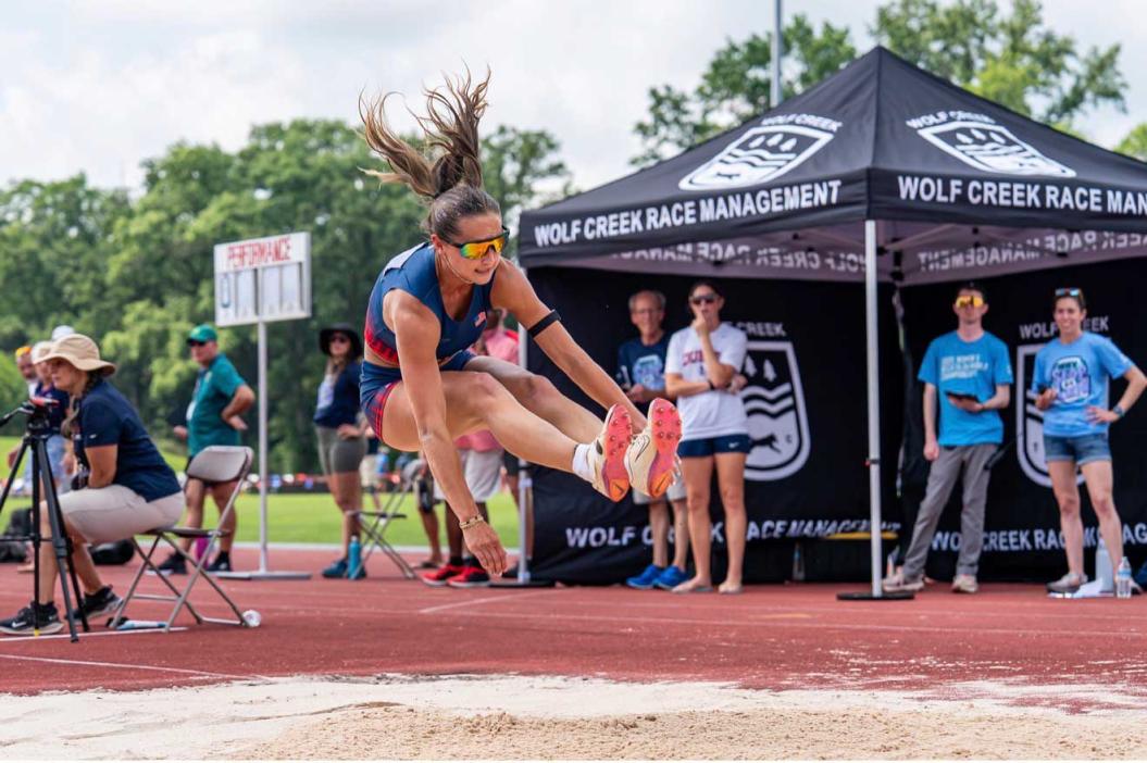 Hannah Hill performing a long jump
