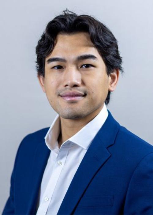 Andy Phuc Du, Louisiana IT Technician, smiling, wearing a blue blazer
