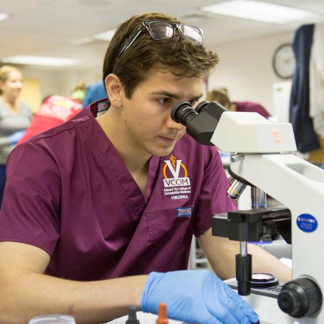 Student with microscope