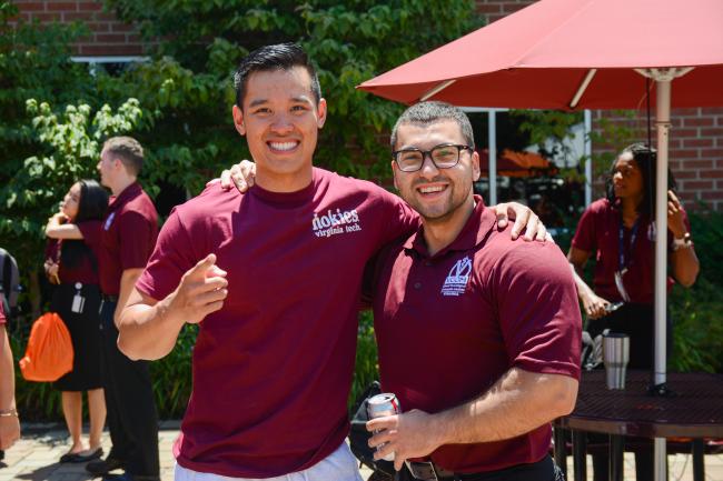 students on campus wearing VCOM shirts
