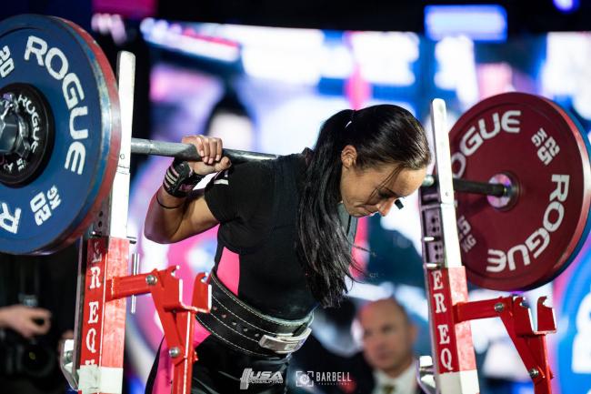 Allison Garden preparing to lift barbell