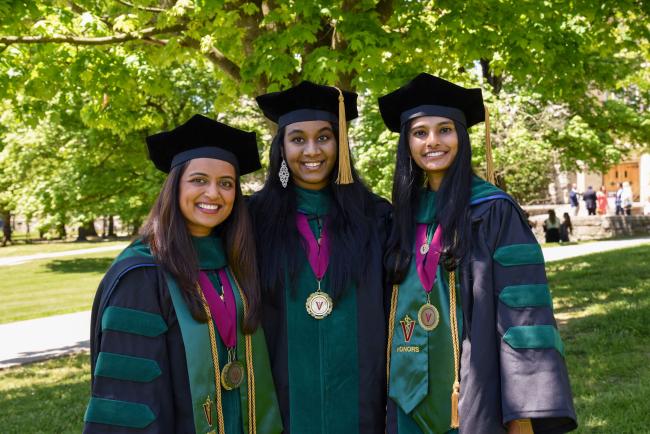 VCOM Virginia graduates posing in regalia