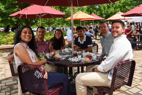 Students sitting at a table eating