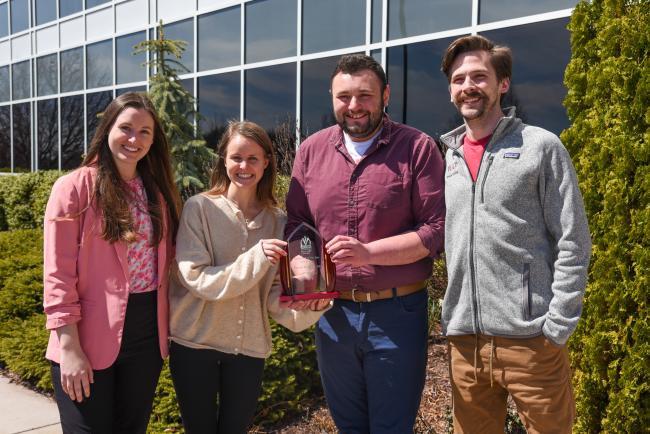 Dr. Bhagtani's students show off her Researcher of the Year Award