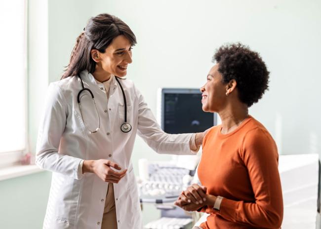 Doctor speaking with patient in office