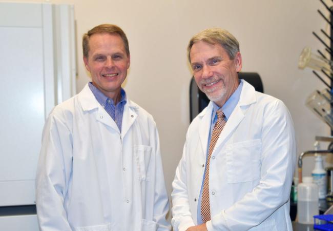 Joseph W. Brewer, PhD standing with Robert L. Judd, PhD