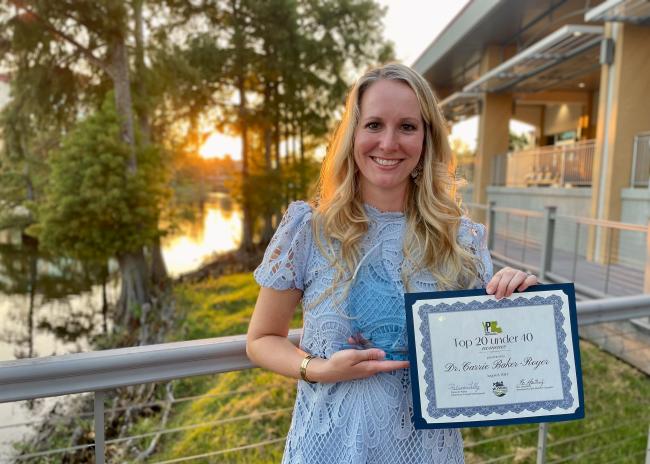 Dr. Carrie Baker-Royer with her Top 20 Under 40 Award