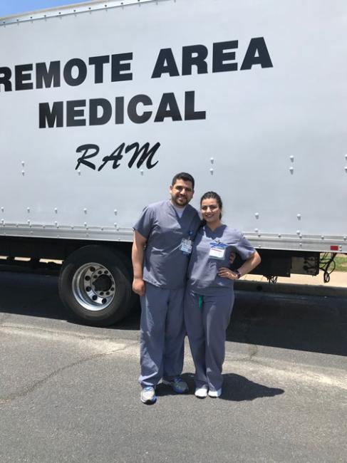 Abdul-Rahman posing in front of remote area medical outreach truck
