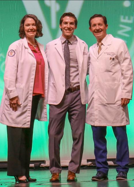 Tyler McCormick wearing his white coat