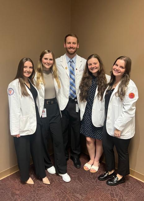 Erin Onken with fellow students in white coats