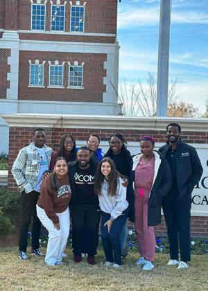Chinaemerem Chukwudoro with fellow students standing in front of VCOM-Louisiana