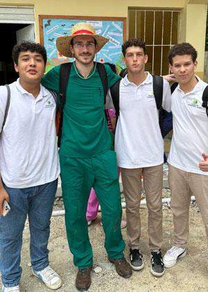 Morgan Hill on a mission trip standing with other volunteers