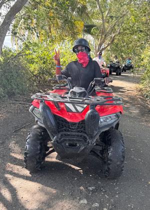 Ade Ojimi riding an ATV