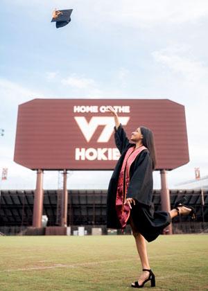 Netra Sivanandan throwing her graduation cap after graduating from Virginia Tech