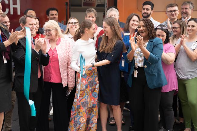 Smiling group after ribbon cutting ceremony