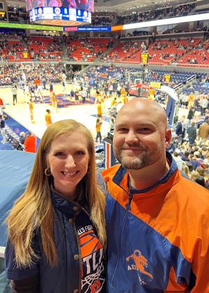 Dr. Mcinnis with husband at a basketball game