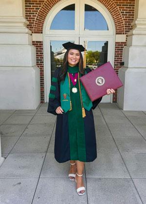 Allison Tran, DO in cap and gown on graduation day