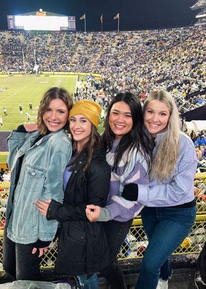 Allison Tran, DO with friends at an LSU football game