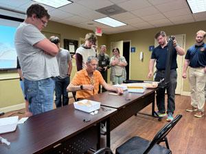 Michael Brisson with others working on rehab with a patient