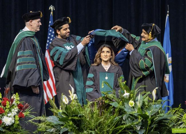 VCOM-Louisiana student being hooded by her family of doctors