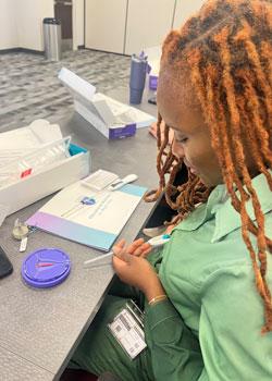 Shelda St. Preux working in a student lab