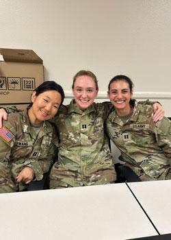 Sydney Gould with others in Army fatigues