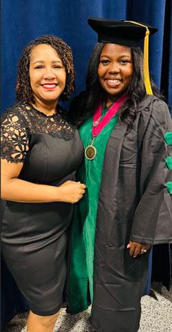 Jamie Rogers in cap and gown with her mentor