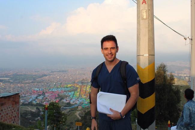 Robert Eysler on a mission trip with a view of the city behind him