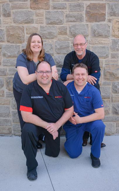 Dr. Tobey, Dr. Harden, Dr. Kozar, and Dr. Robinson smiling