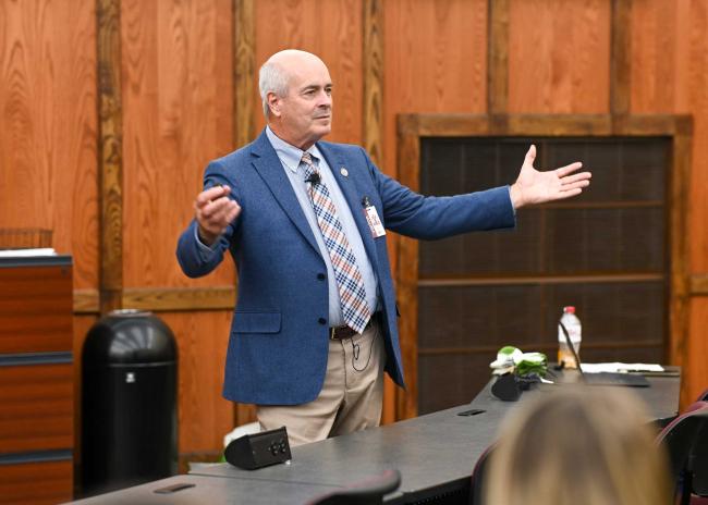 John R. Gimpel, DO, MEd speaking in front of students